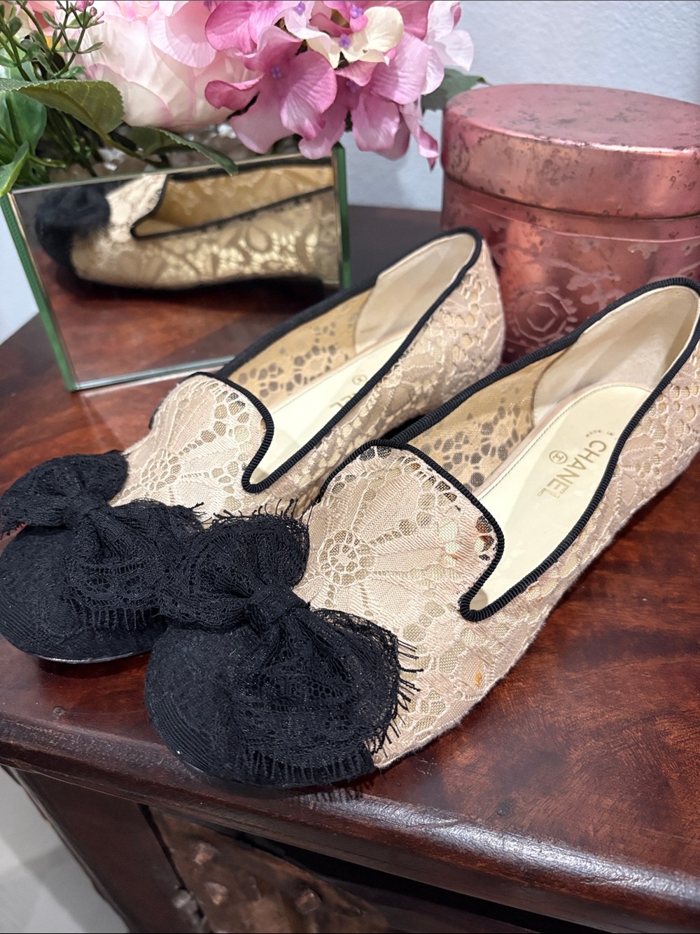 CHANEL Beige Lace Flats with Black Bow Trim